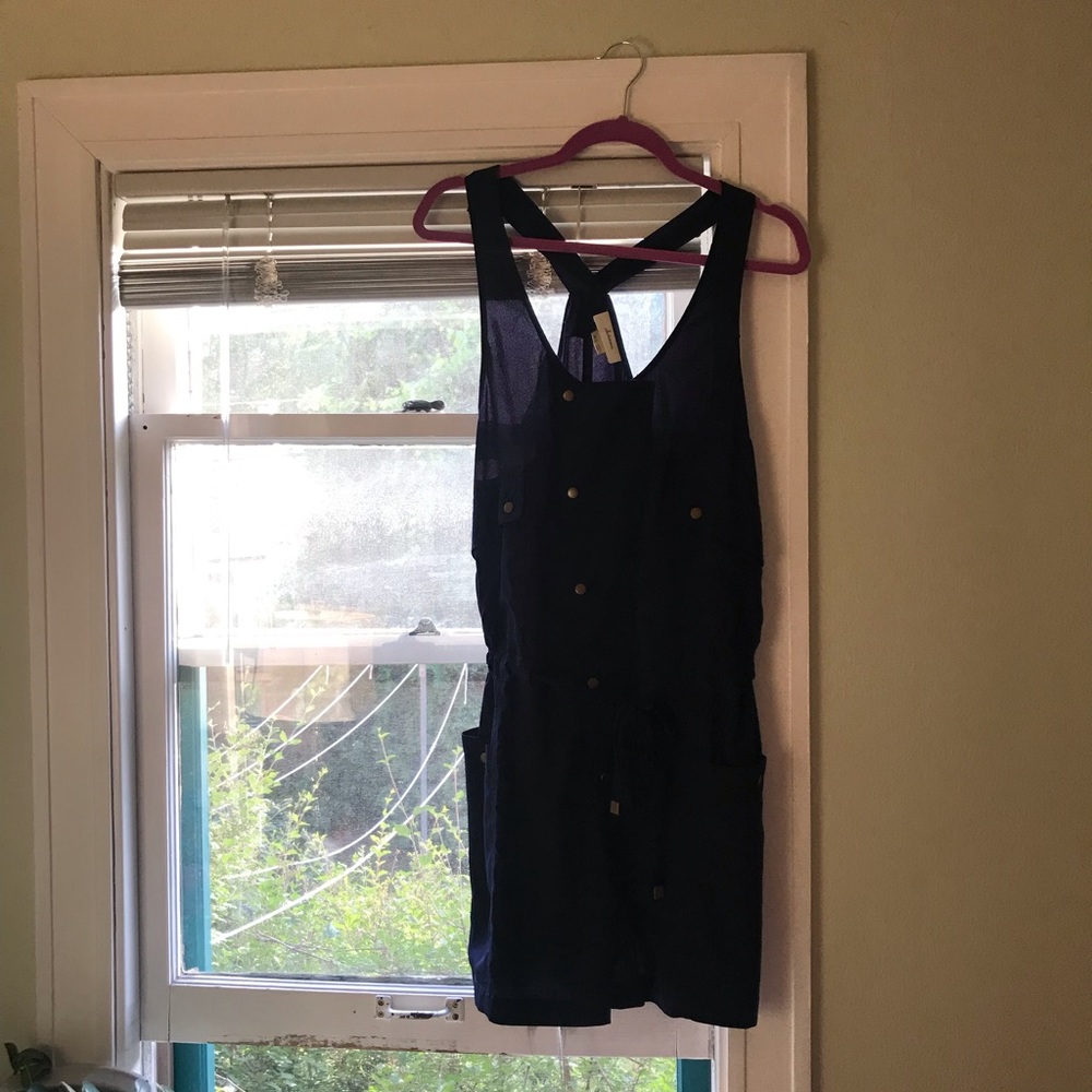 Navy loose fit romper; normal wear and tear. Worn only a handful of times.